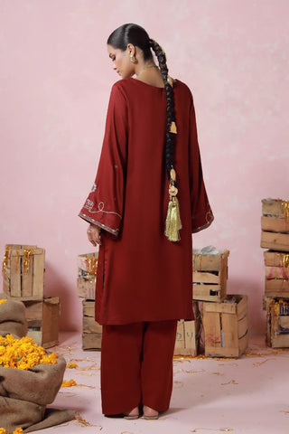 Red 2 piece herringbone set with a short shirt and shalwar, featuring urdu words.
