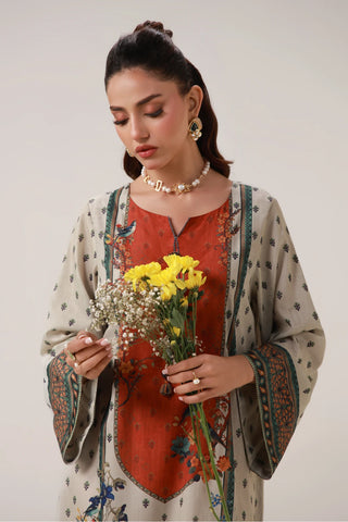 Printed kaftan with embellishments on the neckline, and the words of Jaleel Manikpuri calligraphed across.