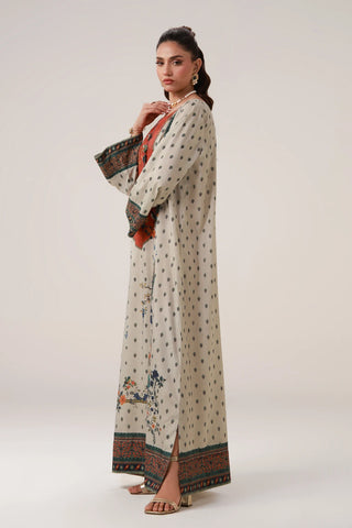 Printed kaftan with embellishments on the neckline, and the words of Jaleel Manikpuri calligraphed across.