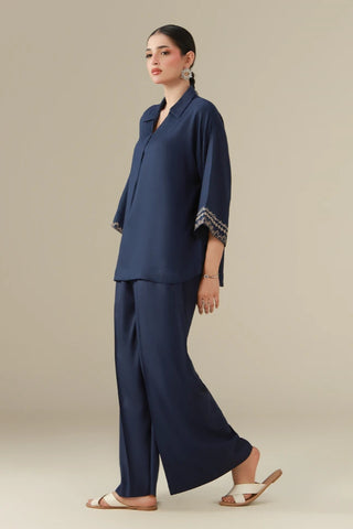 dobby crepe set featuring a short shirt, ijaar pants, and the words of Jaleel Manikpuri embroidered throughout.