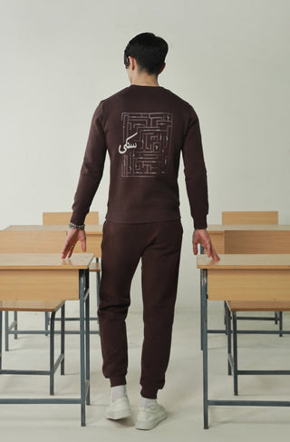 Manto's Unisex Premium Fleece Sanki Brown Sweatshirt featuring Motif with Urdu Calligraphy at the back Paired with Brown Jogger Pants