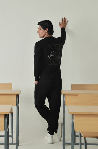 Manto's Unisex Premium Fleece Black Sanki Sweatshirt Featuring Urdu Sanki Motif at the back Paired with Black Jogger Pants